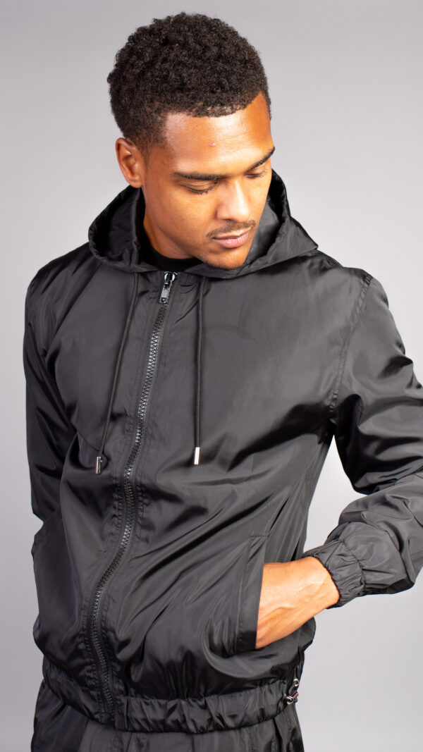 black windbreaker camping
